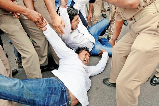 Police detain protesters against Mandsaur incident in Ahmedabad on Friday. 