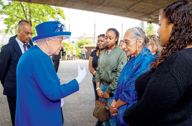 Queen Elizabeth II meets members of the community affected by the fire, on Friday