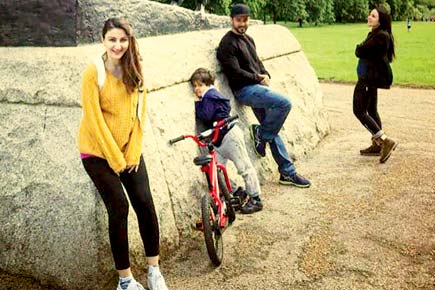 Soha Ali Khan flaunts her baby bump in cute yellow sweater
