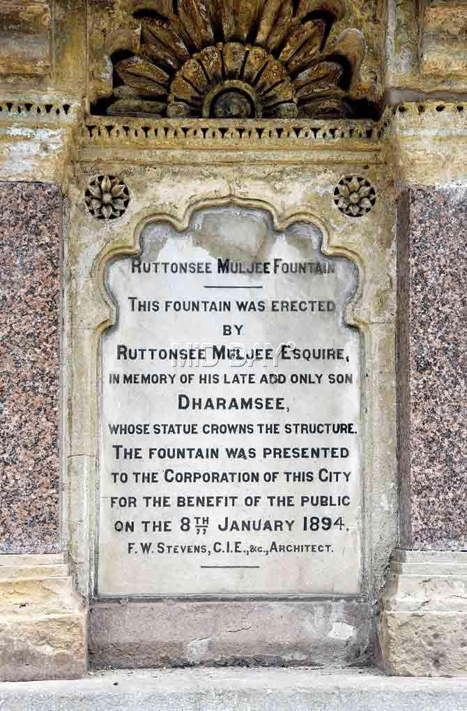 The plaque at the base of fountain that reveals the death of Ruttonsee Mulji’s only son, Dharamsee, and other details including FW Stevens being its architect and the date of its opening to the public.