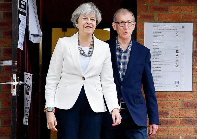 Theresa May and her husband Philip. Pic/AFP