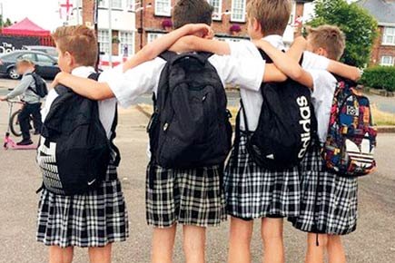 Teen boys protest UK school's shorts ban by arriving in skirts