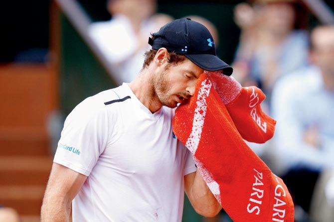 A dejected Andy Murray during his French Open semi-final defeat to Stan Wawrinka at Roland Garros in Paris yesterday. Pic/Getty Images