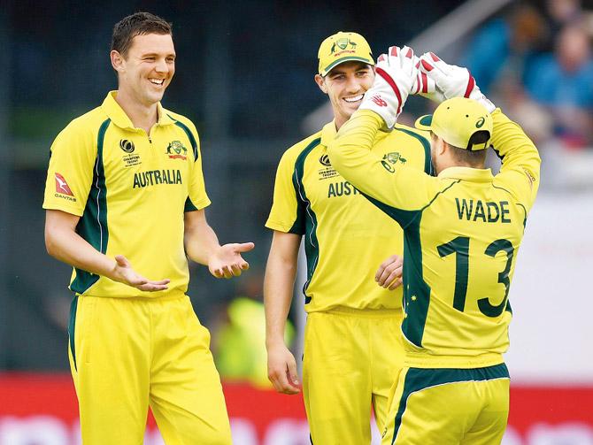 Aussie Josh Hazlewood (left) celebrates a New Zealand wicket  with teammates at The Oval on Monday. Pic/Getty Images