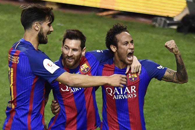 Lionel Messi, Neymar and Andre Gomes. Pic/ AFP