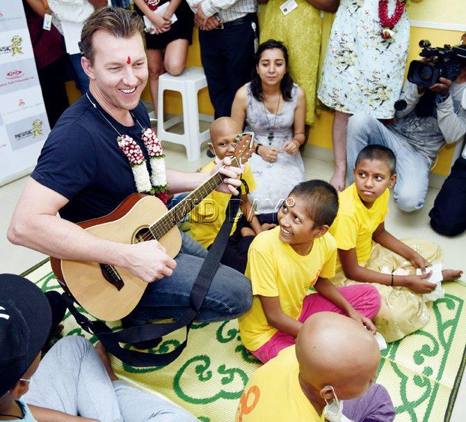 Former Australian pacer Brett Lee strums his guitar for cancer-afflicted children at a centre in Cotton Green yesterday. Pic/Pradeep Dhivar