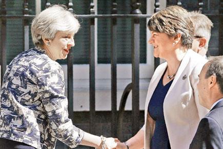May, DUP strike 1 billion pounds deal to prop up minority government