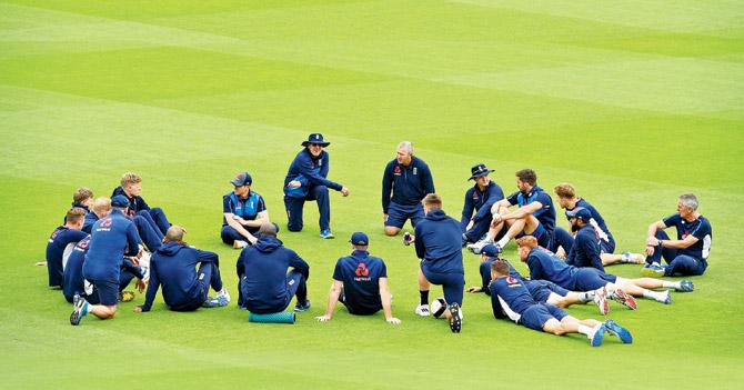 England players hold a team talk at The Oval yesterday on the eve of their Champions Trophy tie vs B’desh today. Pic/AFP