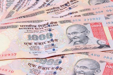 Businessman held with foreign currencies, scrapped notes in Mumbai