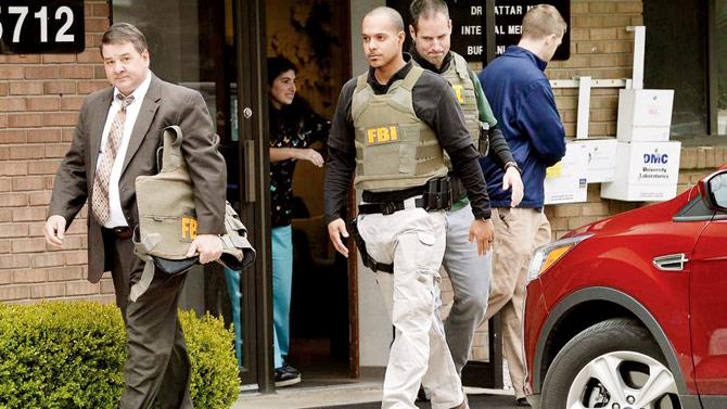 FBI agents leave the office of Dr Fakhruddin Attar at the Burhani Clinic in Livonia, Mich. (USA) in April in connection with an investigation in the Dr Jumana Nagarwala case. Nagarwala was charged with performing FGM on two girls. The US case created a sensation in the Dawoodi Bohra community worldwide, putting an international lens on the discourse