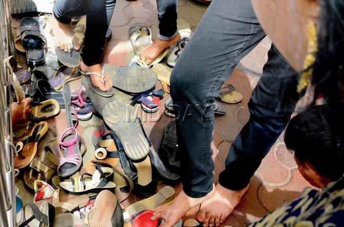Mounds of footwear are dumped outside homes. Pic/Bipin Kokate 