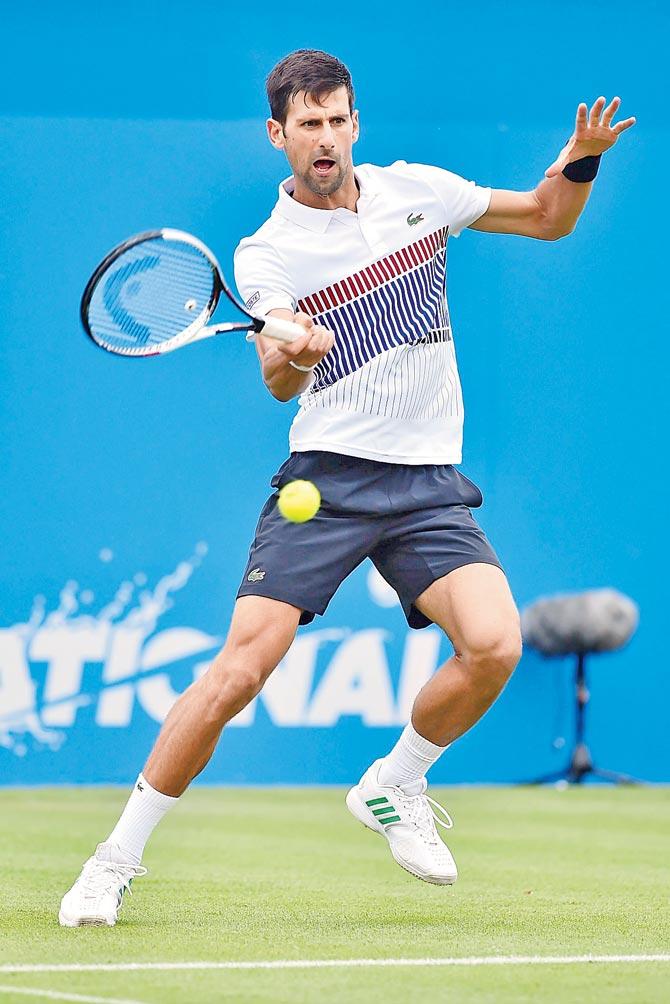 Novak Djokovic returns to Vasek Pospisil in Eastbourne, England