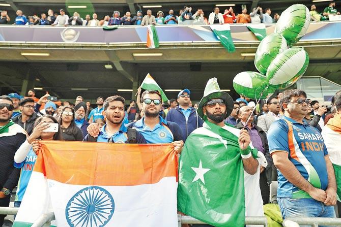 India and Pakistan fans cheer their teams during a match at Edgbaston last week. Pic/Getty Images