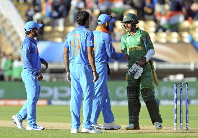 Indian cricket captain Virat Kohli shakes hand with Pakistan