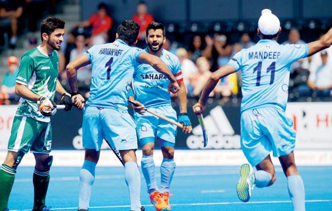 Indian players celebrate a goal against Pakistan during the Hockey World League Semi-Final match at London yesterday 