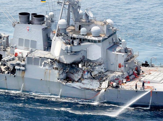 Damage is seen on the guided missile destroyer USS Fitzgerald off the Shimoda coast, after it collided with a Philippine-flagged container ship. Pics/AFP