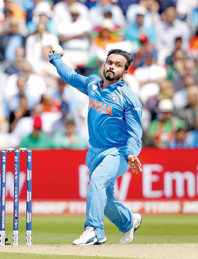 India offie Kedar Jadhav bowls with a side-arm action against Bangladesh yesterday. Pic/AFP