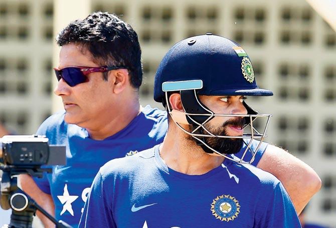 Team India captain Kohli (right) and head coach Kumble in  Saint Kitts last year. Pic/AFP