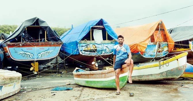 Manish Koli, a professional footballer, also handles his family fishing business. Pic/SatejâÂu00c2u0080Âu00c2u0088Shinde
