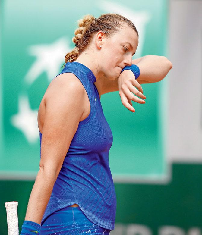 Czech Republic’s Petra Kvitova cuts a forlorn figure after her French Open  second-round  loss yesterday. Pic/Getty Images 