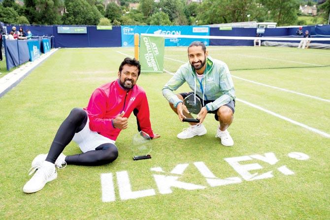 Leander Paes (left) with Adil Shamasdin after winning the men’s doubles title in Ilkley on Saturday. Pic/Getty Images
