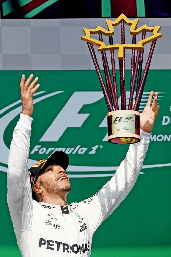 Britain’s Mercedes driver Lewis Hamilton celebrates after winning the Canadian GP at the Circuit Gilles Villeneuve on Sunday. Pic/AFP