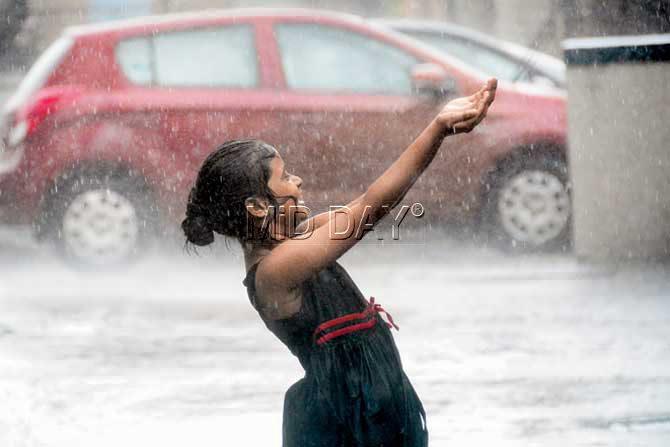 Little girl enjoys in the rain. Pic/ Bipin Kokate