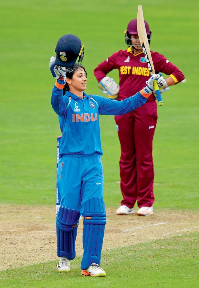 India’s Smriti Mandhana celebrates her century against West Indies  at Taunton yesterday. India won by seven wickets. Pic/Getty Images