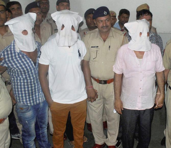 Police produce three of four men, accused in the lynching case, in the District Court in Faridabad yesterday. PIC/PTI