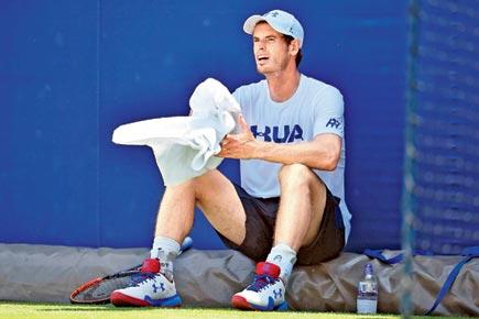 Andy Murray limps with a sore hip, pulls out of Wimbledon warm-up