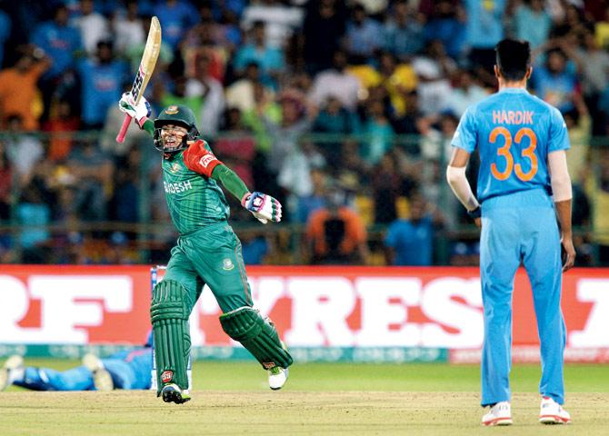 World T20 League Game. Bangladesh’s Mushfiqur Rahim celebrates after scoring a boundary