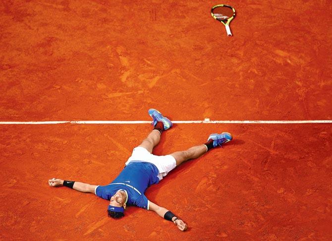 Spain’s Rafael Nadal celebrates his French Open final victory against Swiss Stan Wawrinka at Paris yesterday