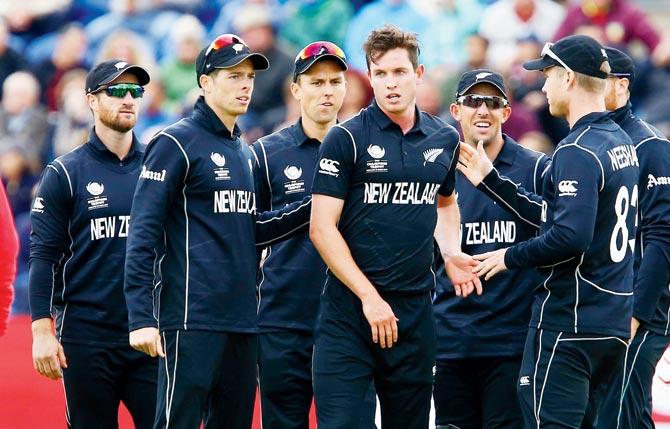 New Zealand players celebrate the fall of an England wicket at Sophia Gardens in Cardiff on Tuesday. England won by 87 runs. Pic/AFP