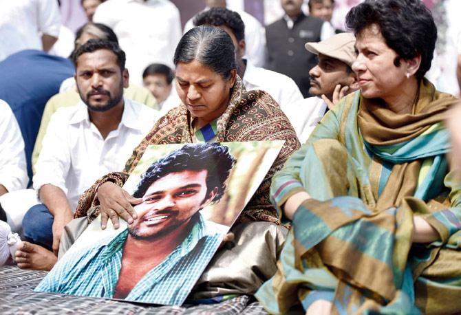 Radhika, mother of Dalit scholar Rohith Vemula, sits in on a protest held in March last year. PIC/GETTY IMAGES