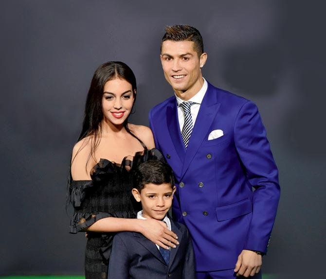Cristiano Ronaldo with girlfriend Georgina Rodriguez and son Cristiano Jr. Pic/AFP