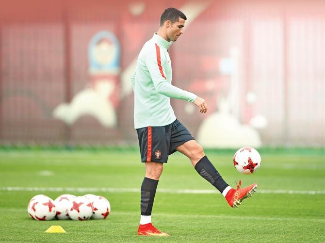 Portugal captain Cristiano Ronaldo trains ahead of their Confederations Cup semi-finals with Chile today. Pic/Getty Images