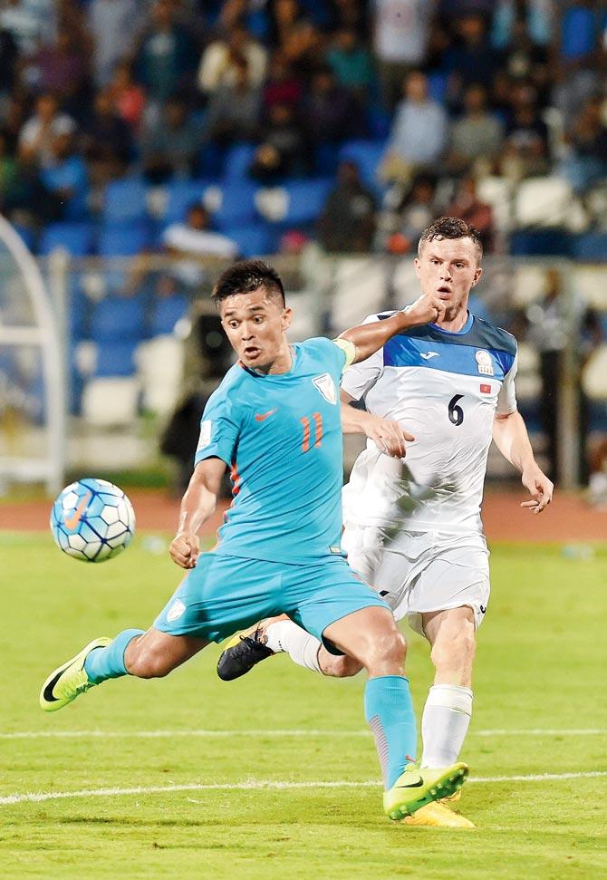 India captain Sunil Chettri (left) scores the winner against Kyrgyzstan during the AFC Asian Cup 2019 qualifier at the Kanteerava Stadium in Bangalore yesterday. India won 1-0. Pic/PTI
