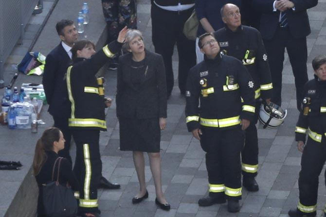 British PM Theresa May orders inquiry into London inferno, toll is 17
