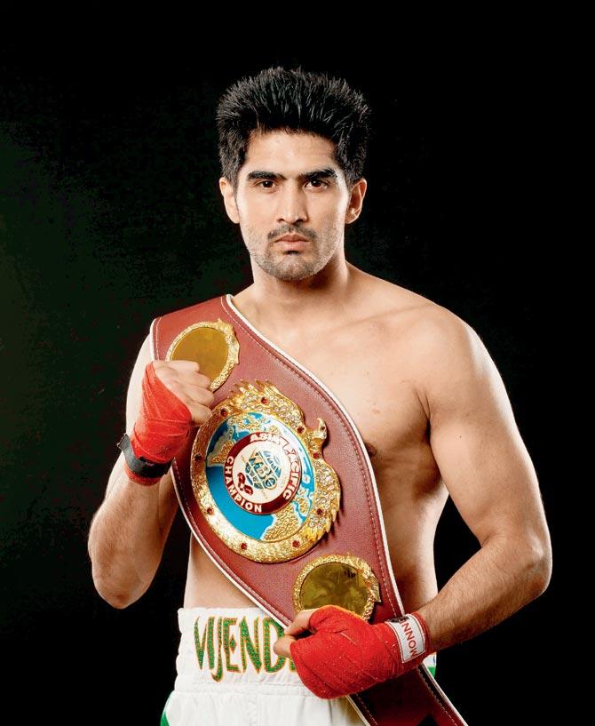 Vijender with the WBO Asia Pacific Super Middleweight title­