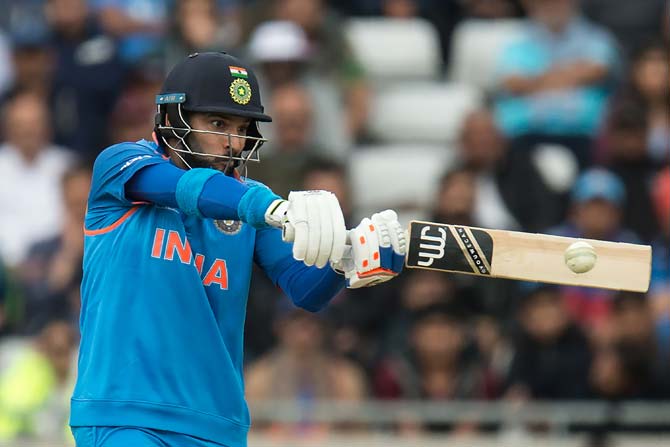 Yuvraj Singh hits a delivery for four against Pakistan. Pic/ AFP