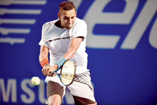 Australia’s Nick Kyrgios returns against Novak Djokovic of Serbia during the Mexico Open quarter-final on Thursday. pic/AFP