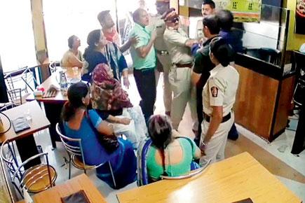 Abuse of power! 'Bully' Mumbai cop in dock for slapping eatery owner