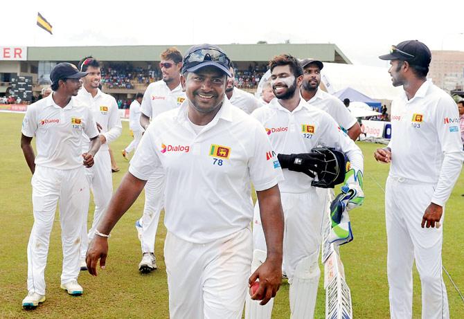 Skipper Rangana Herath leads Sri Lanka off the field after their 259-run win over Bangladesh in Galle on Saturday. Pic/AFP