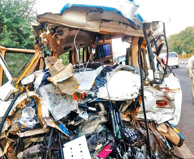 The crushed front of the bus