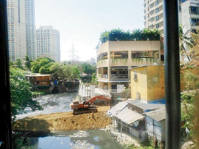 BMC, which is constructing a bridge over the river, has been dumping mud in it