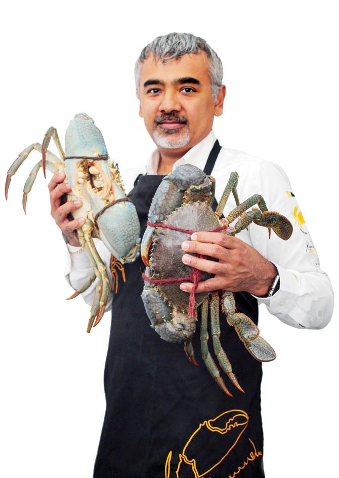 Munidasa with fresh tuna and crab at his restaurants