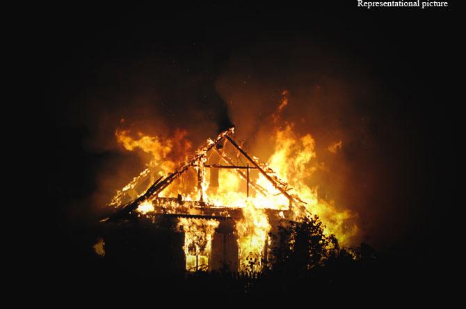 Daughter creepily laughs as she sets house with her father in it on fire