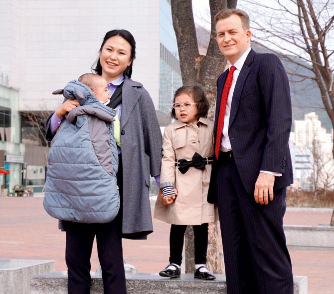 Robert Kelly (right) with his wife Kim Jung-a and their children nine-month-old son, James and daughter Marion. Pic/AFP