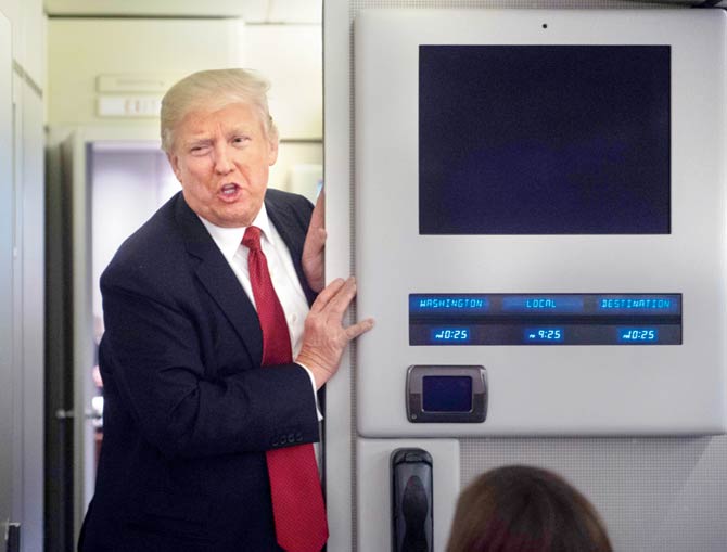 Donald Trump aboard the Air Force One. Pic/AFP