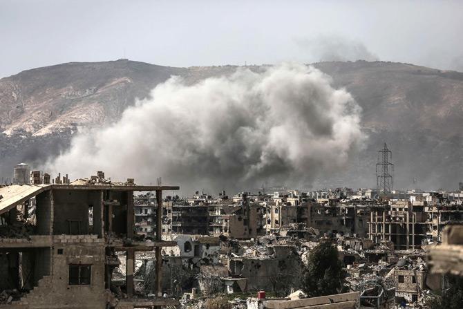 Smoke billows following a reported air strike in the rebel-held parts of the Jobar district, on the eastern outskirts of the Syrian capital Damascus, on March 19, 2017. Heavy clashes rocked eastern districts of Damscus as rebels and jihadists tried to fight their way into the city centre in a surprise assault on government forces. Pic/AFP